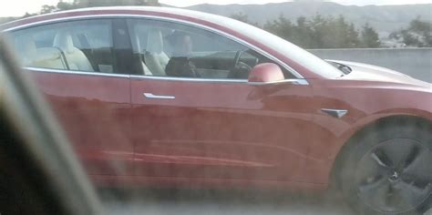 Tesla Model 3 with new white interior spotted in the wild | Electrek