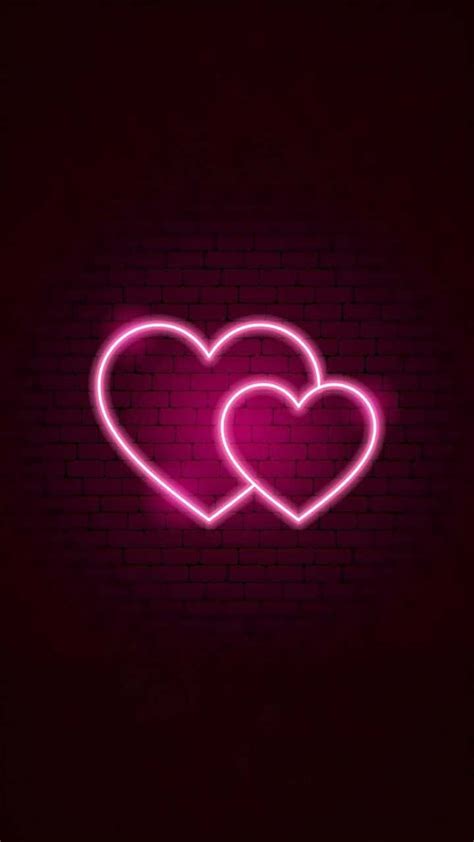 Download Two Pink Neon Hearts With Brick Wall Wallpaper | Wallpapers.com