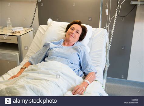 Woman lying in hospital bed Stock Photo - Alamy