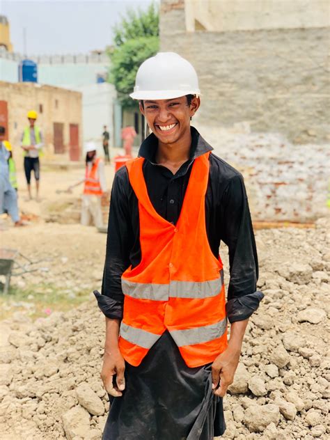 A Young Man Working in Construction · Free Stock Photo