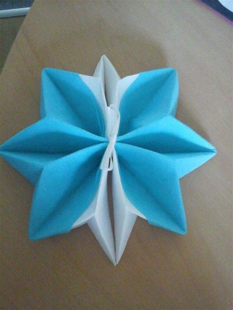 Snowflake napkin folding turquoise blue and white