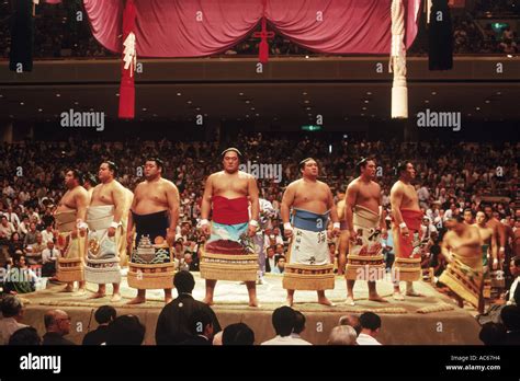 Pre fight sumo wrestling ceremony of competitors parading around ring ...