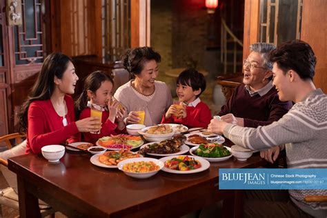 Happy Chinese family eating dinner for Chinese New Year-High-res stock ...