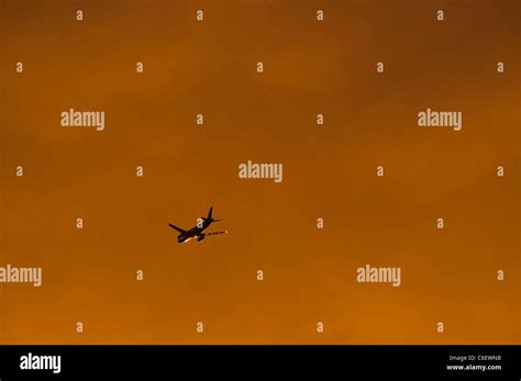 Airplane silhouette at sunset Stock Photo - Alamy