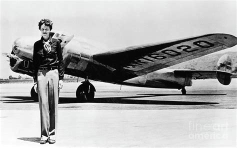 Amelia Earhart with Lockheed Electra 10E Photograph by Aviation History ...