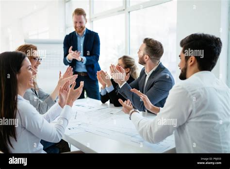 Happy business people celebrating success Stock Photo - Alamy