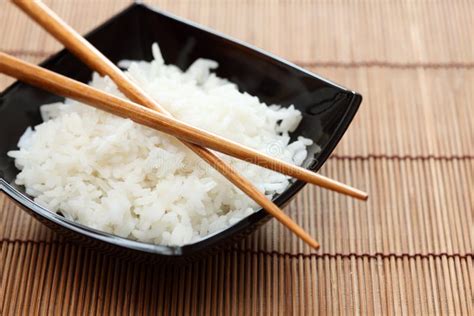 Bowl of Rice with Chopsticks Stock Photo - Image of chopsticks, organic ...