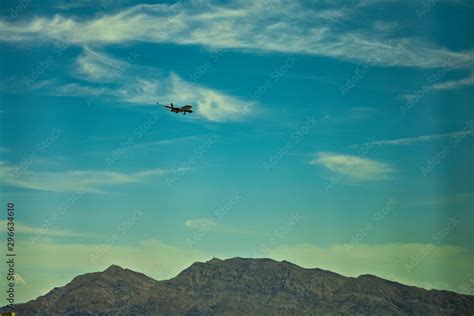 Flying plane above mountains Stock Photo | Adobe Stock