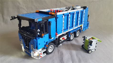 a lego truck and trailer are shown on a gray background with the toy ...