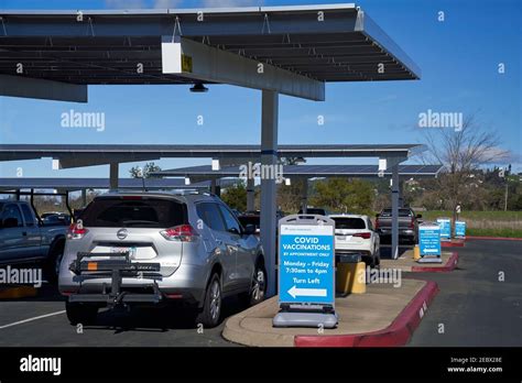 Covid vaccination signs at parking lot of Kaiser Permanente in Santa ...