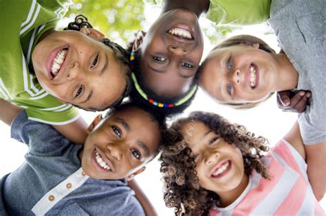 Children Smiling in a Huddle - Southern Star Dental Southern Star Dental