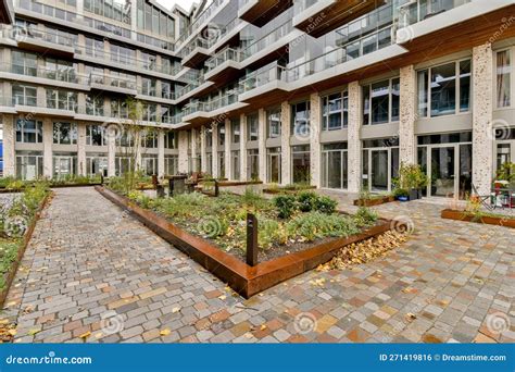 A Courtyard with Plants in Front of a Building Editorial Photo - Image ...