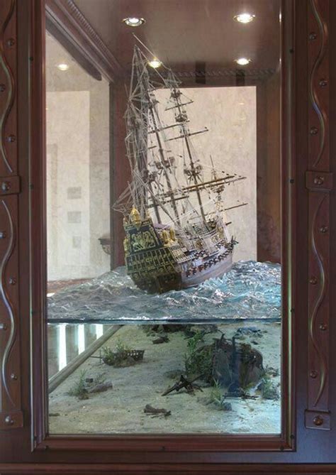 Display case/model of a tall ship at sea above sunken ships. | Model ...