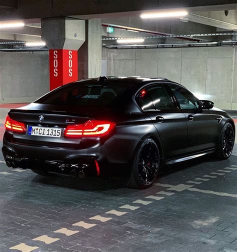 a black car parked in a parking garage