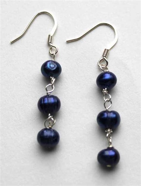 Items similar to Silver & cobalt blue pearl earrings on Etsy