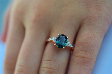 Teal sapphire engagement ring. Peacock green sapphire 3ct oval diamond ...