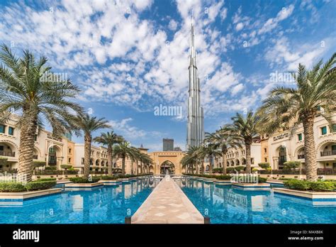 The Palace Hotel and reflective pool with the Burj Khalifa in downtown ...