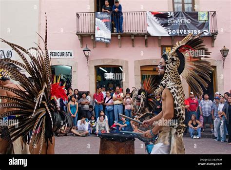 An AZTEC DANCE TROUPE performs in traditional feathered COSTUMES at the ...