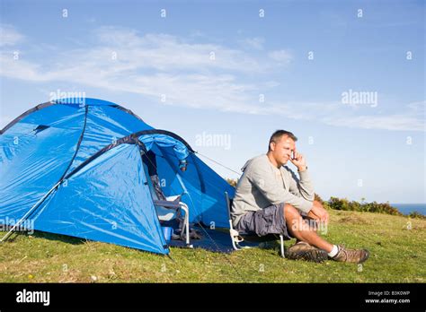 Man camping outdoors Stock Photo - Alamy