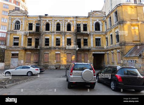 Old abandoned house in the city center. Two-storey old house without ...