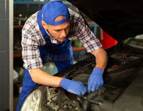 Positive Man Car Mechanician Repairing Car in Auto Repair Service Stock ...