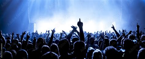 cheering crowd at a rock concert Stock Photo | Adobe Stock