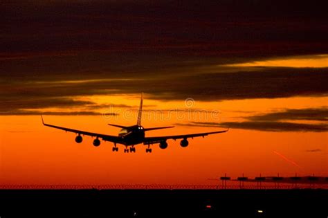 Landing plane on a sunset stock photo. Image of landing - 727008