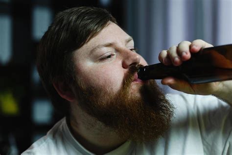 Close-up of a man drinking a beer 1484741 Stock Photo at Vecteezy