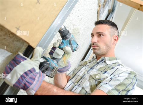 Installing wall partition Stock Photo - Alamy