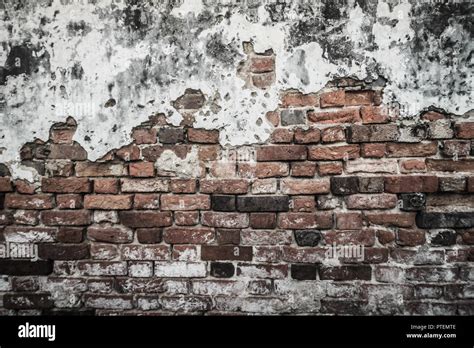 Grungy historical broken brick wall background in sunny summer day ...