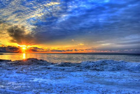 Sunrise on the horizon at Whitefish Dunes State Park, Wisconsin image ...