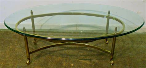 30 Collection of Oval Glass and Wood Coffee Tables