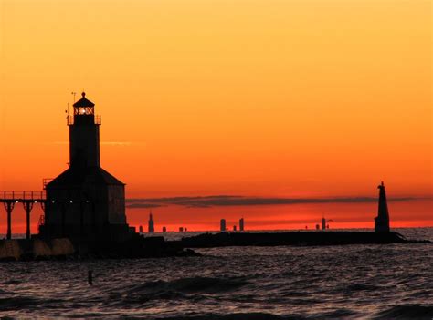 Sunset on Lake Michigan at Michigan City with view of Lighthouse and ...