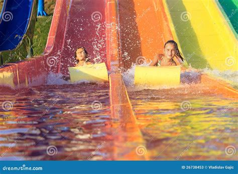 Girls on the water slide stock image. Image of outdoor - 26738453