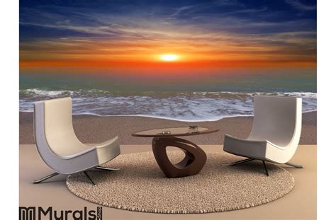 Sunset over ocean beach Wall Mural