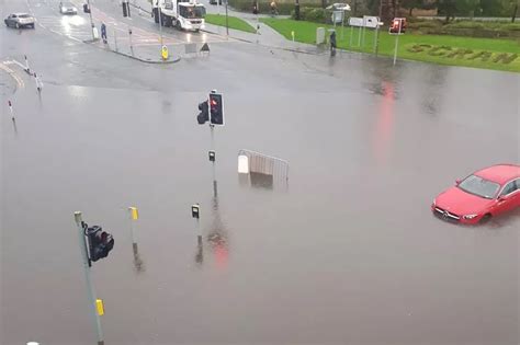 Busy Edinburgh road flooded as heavy rain causes…