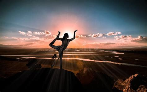 Young Woman Enjoying Yoga from the Top of a Mountain Stock Photo ...