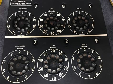 an analog clock with four different dials on it