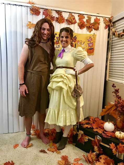 two people dressed in costumes standing next to each other