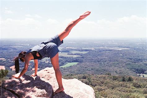 "Girl Practicing Yoga At The Top Of A Mountain Overlook With A ...