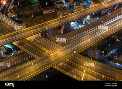 Top view of massive expressway at night with light of cars ...