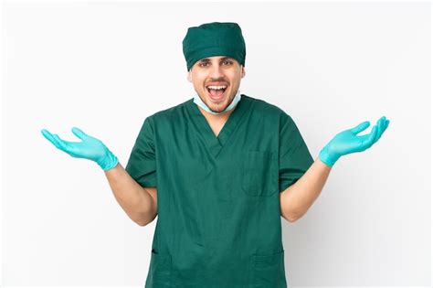 Premium Photo | Surgeon man in green uniform over isolated