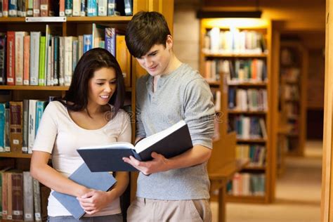 Young Students Reading a Book Stock Photo - Image of cooperation ...