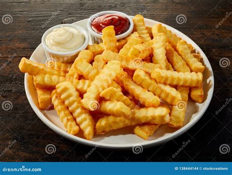 Plate of Crinkle Cut French Fries with Dips Stock Photo - Image of ...