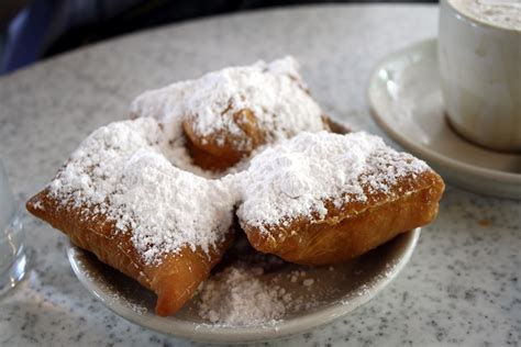 fried dough with powdered sugar