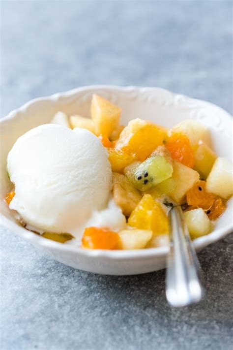 Fruit Salad with Vanilla Ice Cream in Ceramic Bowl Stock Photo - Image ...