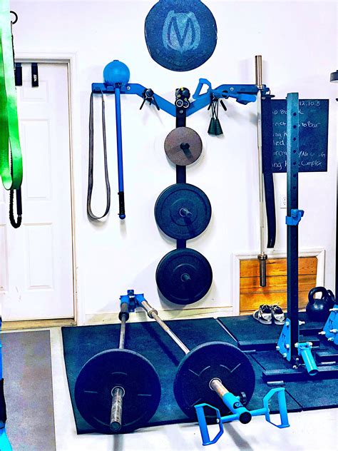 Garage gym wall mount Olympic plate storage rack along with wall mount ...