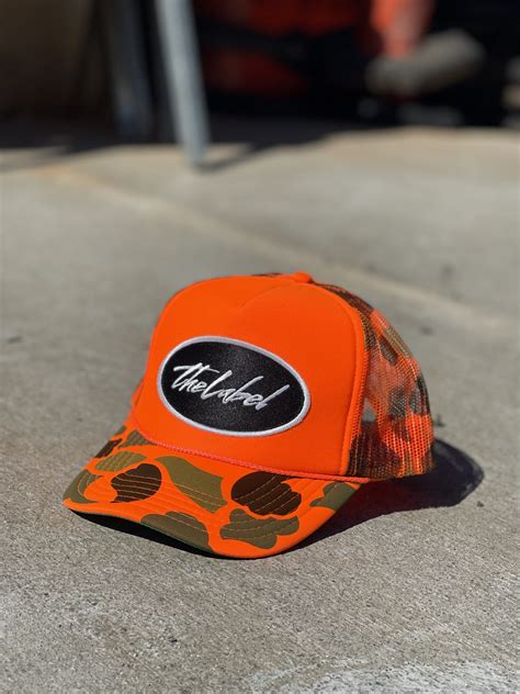 Trucker Hat – “Orange Camo” – The Label Apparel