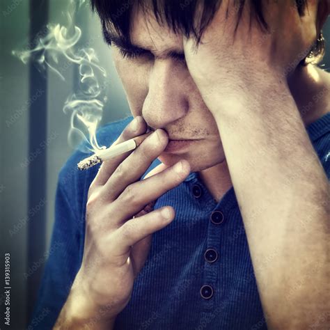 Sad Man with Cigarette Stock Photo | Adobe Stock