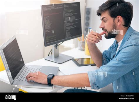 Man working on his laptop Stock Photo - Alamy